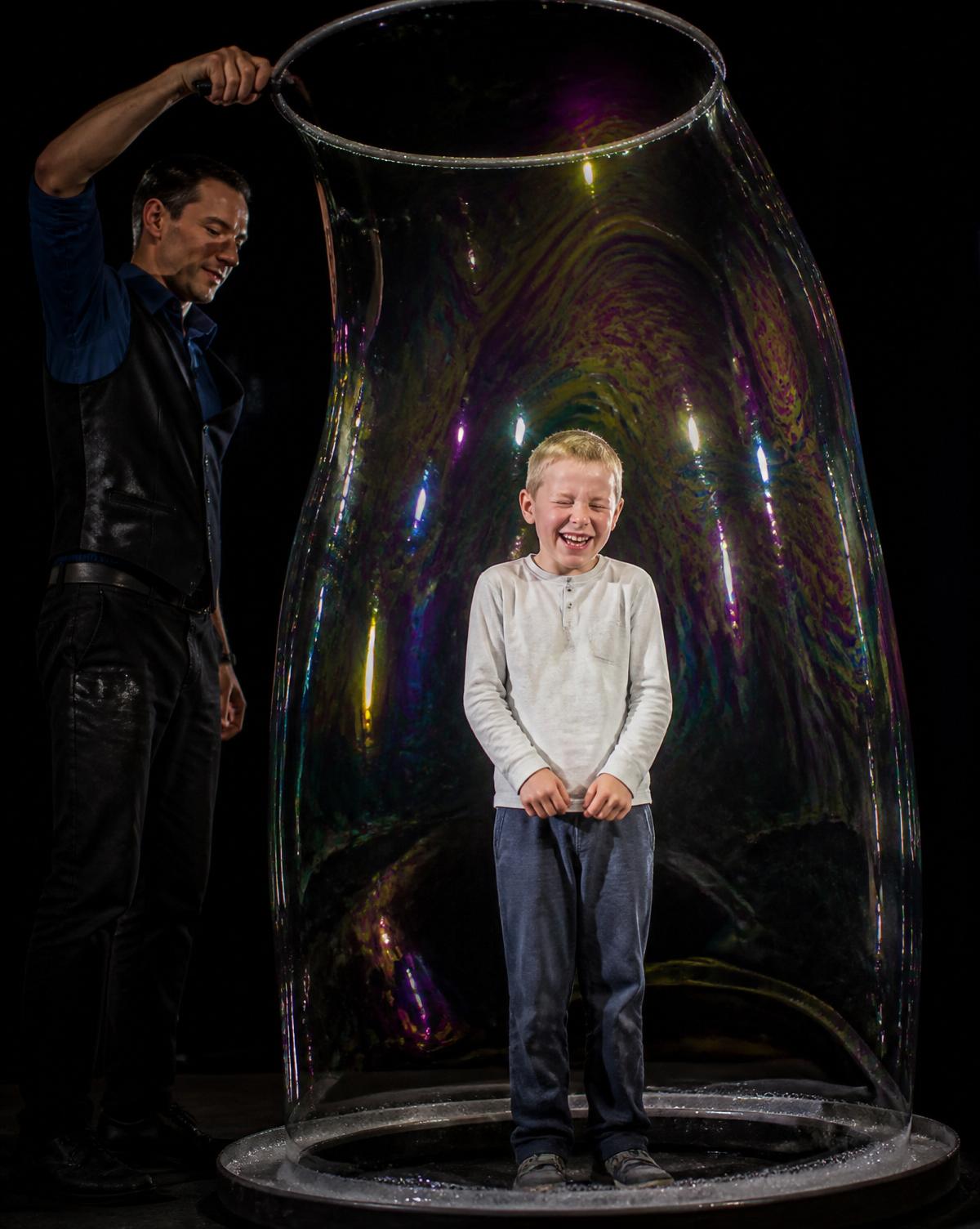 Bubble show performer with children